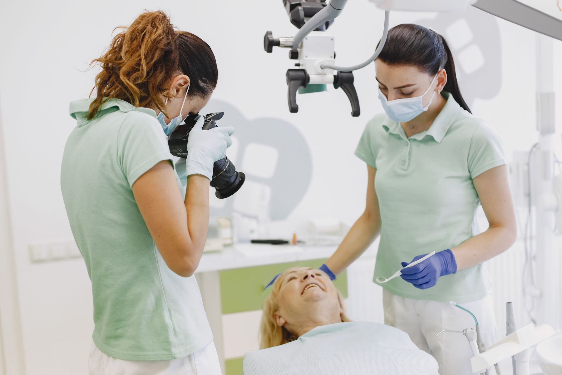 Dental clinicians documenting a treatment in a bright modern surgery